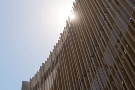 The Learning and Teaching Building at Monash University features a perforated metal facade. Photography: Rob Burnett.