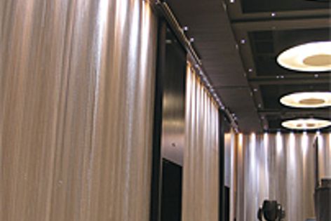 Wire mesh fabrics by the Locker Group can be used as curtains or to sculpt space.