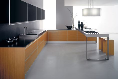 The MDF-free cabinets in the Plana Kitchen are curved and handle-free for a minimalist effect.