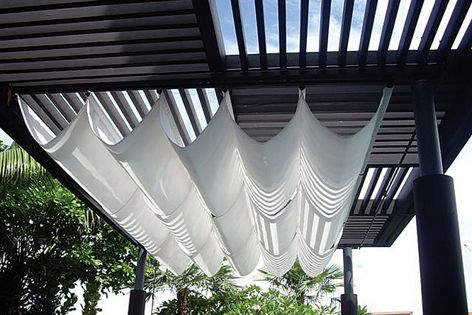 Fade-resistant Sunbrella fabrics can be used to accent a pergola or terrace.