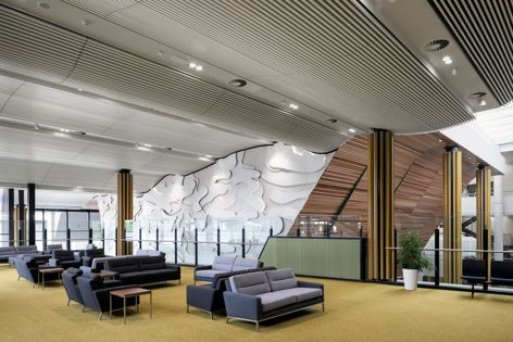 Screenwood timber acoustic panels, shown in the 6030 profile in hemlock, are ideal for large workplaces where echo reduction is critical. Architect: Lyons Architecture.